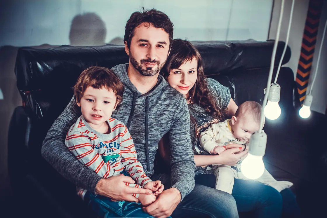 Florida family of four at home, representing the layered coverage horizon a term ladder is designed to match